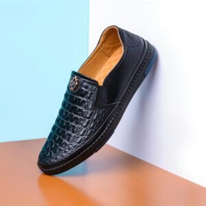 Stylish black leather shoe elegantly displayed, highlighting luxury fashion design.